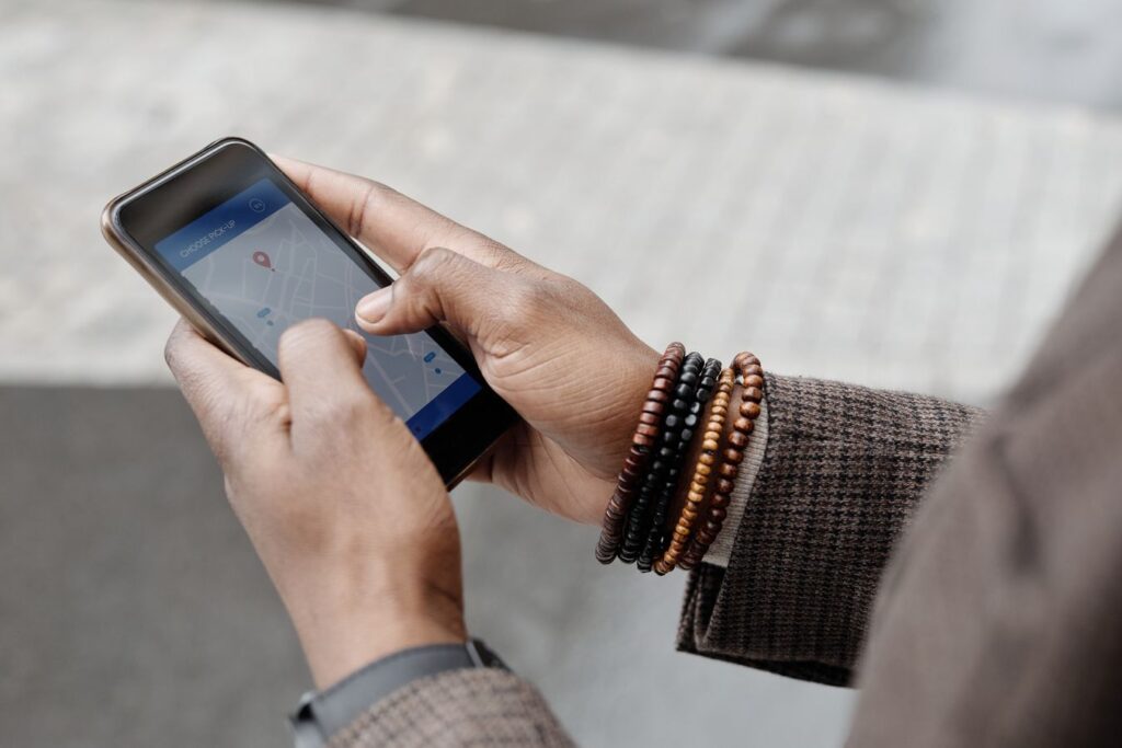 Person using Google Maps on a smartphone to search for a local business